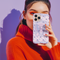 Coquette phone case featuring a pastel purple bow and pink floral lace background, dual-layer protection, UV protected, compatible with iPhone, Samsung Galaxy, and Google Pixel.
